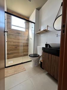 Koupelna v ubytování Reserva 1202 - Hospedagem + 8 fotografií