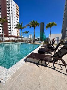 Bazén v ubytování Reserva 1202 - Hospedagem nebo v jeho okolí