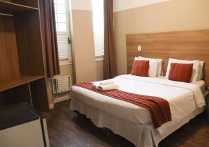 Cama ou camas em um quarto em Kastel Grão Pará