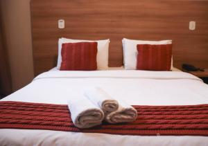 Cama ou camas em um quarto em Kastel Grão Pará