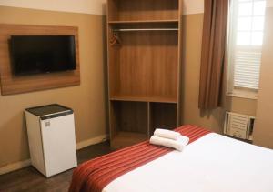 Cama ou camas em um quarto em Kastel Grão Pará