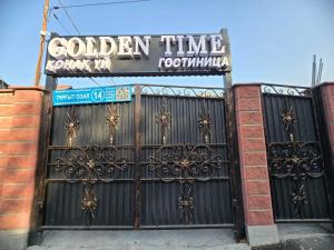 Una puerta a un edificio con un cartel. en Golden Time, en Almaty 17 fotos más