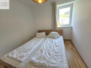Postel nebo postele na pokoji v ubytování Alpine Tauplitz TOP 5