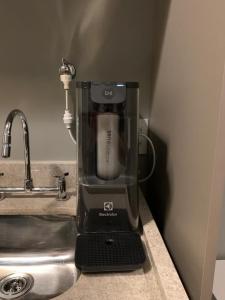 a mixer sitting on a counter next to a sink at Get a Flat 1905 - Brooklin in Sao Paulo +28 photos