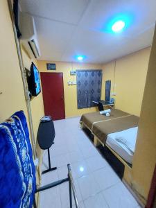 Irama Resort Amir YJS , Pantai Irama Bachok客房内的一张或多张床位