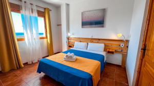 Postel nebo postele na pokoji v ubytování La Tortuga Lodging Rooms
