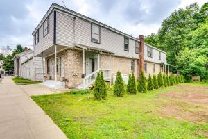 a house with christmas trees in front of it at Cozy Berkshires Vacation Rental Near Hiking! in Chester