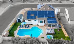 an aerial view of a house with solar panels on it at Glendale Nights - Pool Hot Tub Put Put Foosball in Glendale