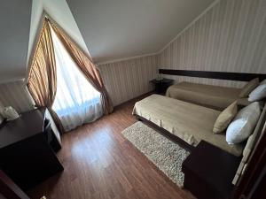 Postel nebo postele na pokoji v ubytování Mini-Hotel in Kharkiv