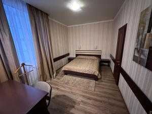 Postel nebo postele na pokoji v ubytování Mini-Hotel in Kharkiv