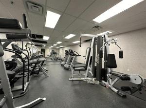 a gym with several treadmills and machines in it at Stunning 1-Bedroom Condo in the Heart of Vancouver in Vancouver +4 photos