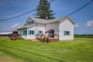 a white house with a large yard at Penn Yan Vacation Rental Near Seneca and Keuka Lakes in Penn Yan