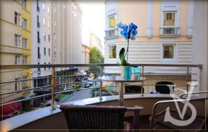 a balcony with a table and blue balloons on it at SV Bussiness Hotel Taksim in Istanbul