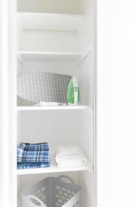 a white refrigerator with its door open with its shelves at Cozy 1 Bed Sleeps 4! Near Strip Perfect GetAway! in Las Vegas +1 photo