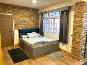 Postel nebo postele na pokoji v ubytování Norbu Thungkar Homestay