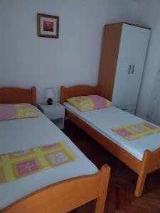 Postel nebo postele na pokoji v ubytování Apartment Miletic