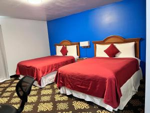 Postel nebo postele na pokoji v ubytování Midway Motel + 4 fotografie