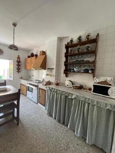 a kitchen with a counter top in a room at Casa de Don Paco in Pastrana