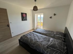 Ένα ή περισσότερα κρεβάτια σε δωμάτιο στο Maison Léonora