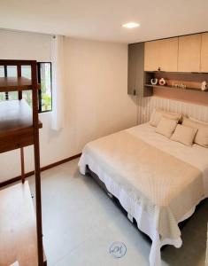 a bedroom with a bed and a ladder in it at Flat Patacho - Rota Ecológica dos Milagres in Pôrto de Pedras