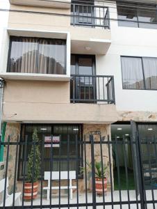 a building with a fence in front of it at Apartamento Con Excelente Ubicacion en Cali in Cali