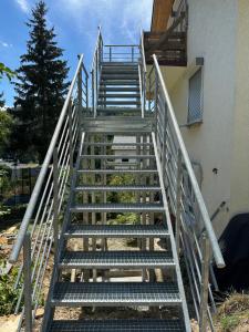 a set of stairs leading up to a building at Ferienwohnung 14 in Zwiefalten