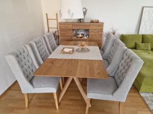 a dining room with a table and two chairs at Waldorf Apartment in Ljubljana
