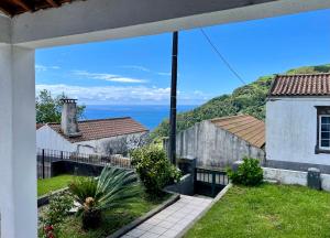 a view of the ocean from the balcony of a house at Casa Cidalisa in Povoação