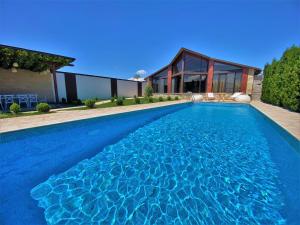 a swimming pool in the backyard of a house at Bloom House in Zovuni +27 photos