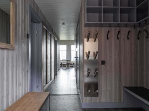 a hallway with a room with a wall with scissors at Kopparvillan 37B - Åre Valley Lodges in Åre