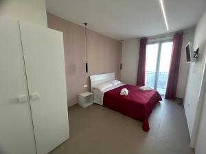 Postel nebo postele na pokoji v ubytování Arkè Rooms