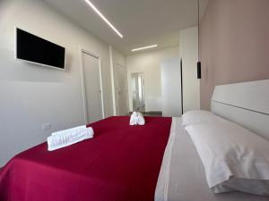 Postel nebo postele na pokoji v ubytování Arkè Rooms