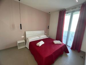 Postel nebo postele na pokoji v ubytování Arkè Rooms