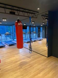 a gym with a red punching bag in a room at On Paulista - Confort Studio in São Paulo