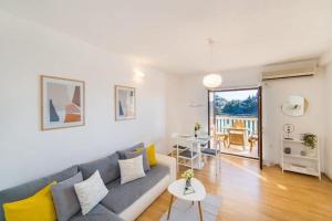 a living room with a couch and a table at Apartments Luxury apartments in Ploče
