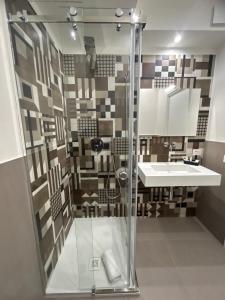 Koupelna v ubytování Arkè Rooms + 37 fotografií