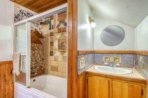 a bathroom with a tub and a sink at Les chalets du village in Mont-Blanc +53 photos