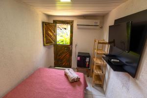 Postel nebo postele na pokoji v ubytování Noronha Economy Suítes - Hospedagem com melhor localização e custo benefício da ilha