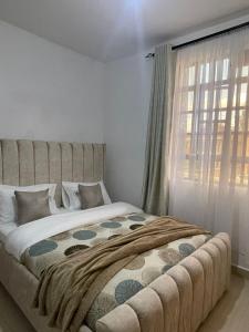 Postel nebo postele na pokoji v ubytování Naivasha Executive Villa - Bosque