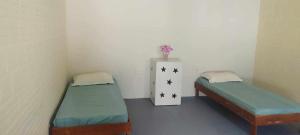 Postel nebo postele na pokoji v ubytování Hostel e Pousada Israel