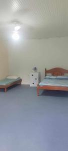 Postel nebo postele na pokoji v ubytování Hostel e Pousada Israel