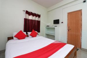 Postel nebo postele na pokoji v ubytování Super Hotel O Nandi Inn