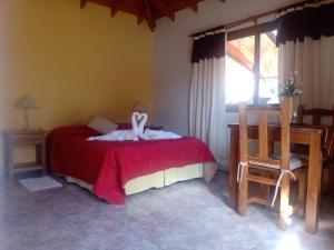 Postel nebo postele na pokoji v ubytování AMALGAMA CABAÑAS