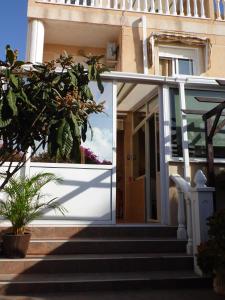a glass door on a house with stairs at Villa La Zenia, Private pool, 10min walk to La Zenia Beach, for 6 people in Playas de Orihuela +46 photos