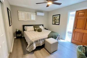 a bedroom with a bed and a ceiling fan at Apartment A, Restful,Cozy, close Sunland Park Mall in El Paso