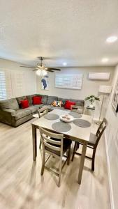 a living room with a table and chairs and a couch at Apartment A, Restful,Cozy, close Sunland Park Mall in El Paso