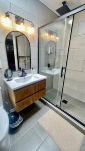 a bathroom with a sink and a shower at Apartment A, Restful,Cozy, close Sunland Park Mall in El Paso +21 photos