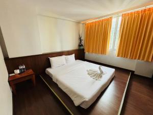 Postel nebo postele na pokoji v ubytování Aloha Budget Hotel hatyai