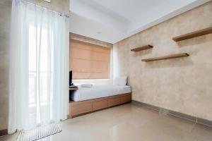 Postel nebo postele na pokoji v ubytování Cozy Stay Studio Room Apartment at B Residence By Travelio + 7 fotografií