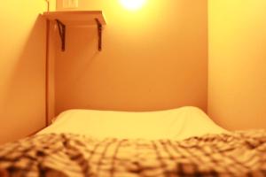 Rúm í herbergi á Guest house cocode